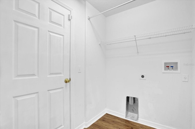 washroom with dark hardwood / wood-style flooring, washer hookup, and electric dryer hookup