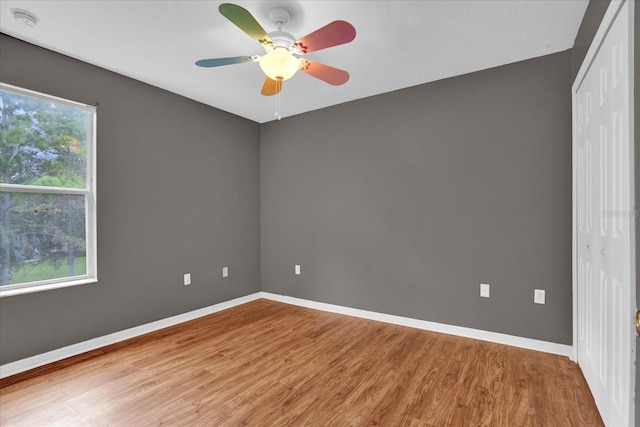 spare room with light hardwood / wood-style floors and ceiling fan