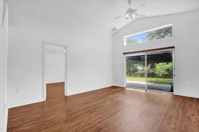 unfurnished living room with ceiling fan, plenty of natural light, and dark hardwood / wood-style flooring