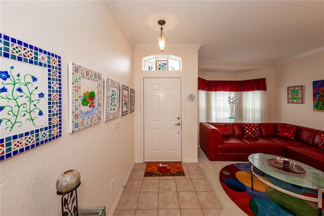 foyer entrance with light tile patterned floors, plenty of natural light, and ornamental molding