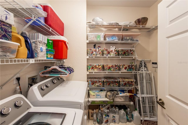 laundry area with independent washer and dryer