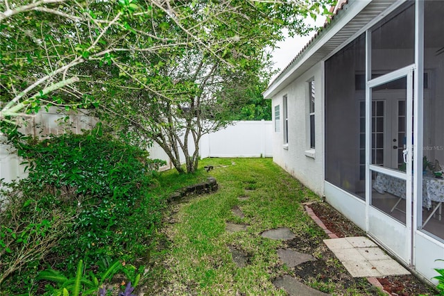 view of yard with a sunroom