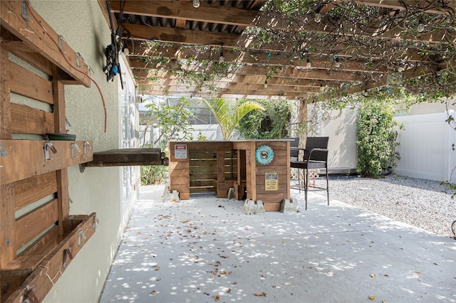 view of patio / terrace featuring fence