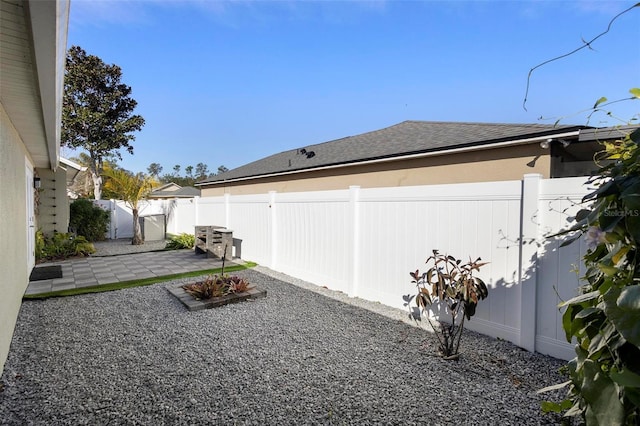 view of yard featuring a patio and a fenced backyard