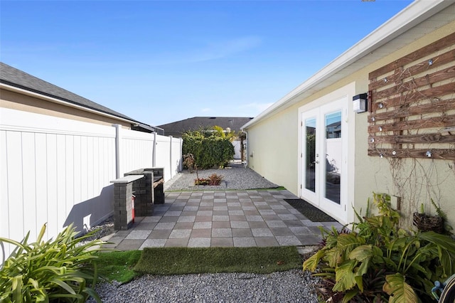 view of patio / terrace featuring french doors and a fenced backyard