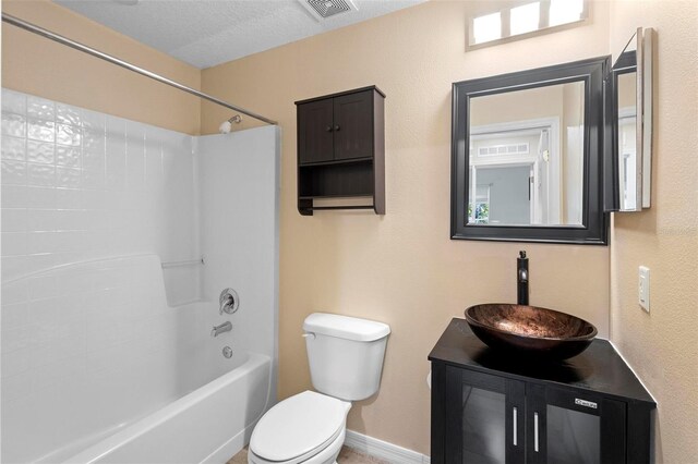 full bathroom with visible vents, vanity, toilet, and tub / shower combination