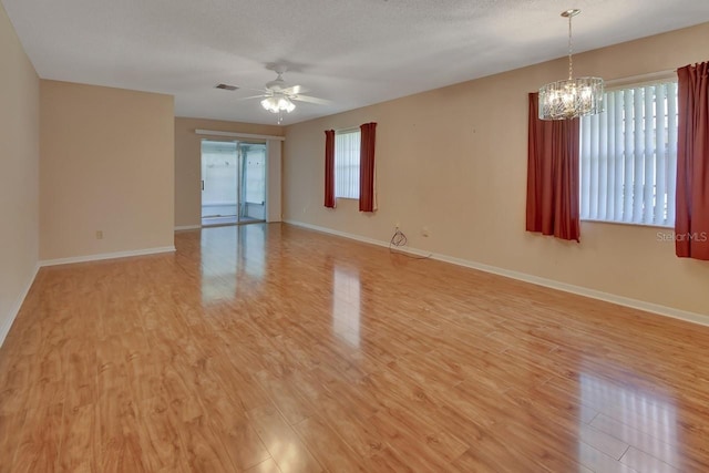 unfurnished room with plenty of natural light and light hardwood / wood-style flooring