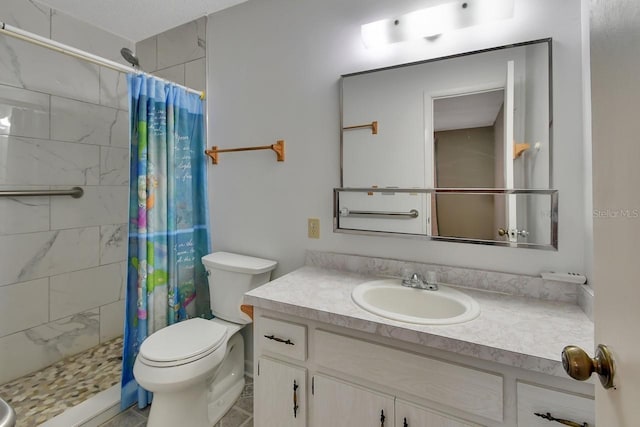 bathroom with tile patterned flooring, toilet, a shower with shower curtain, and vanity