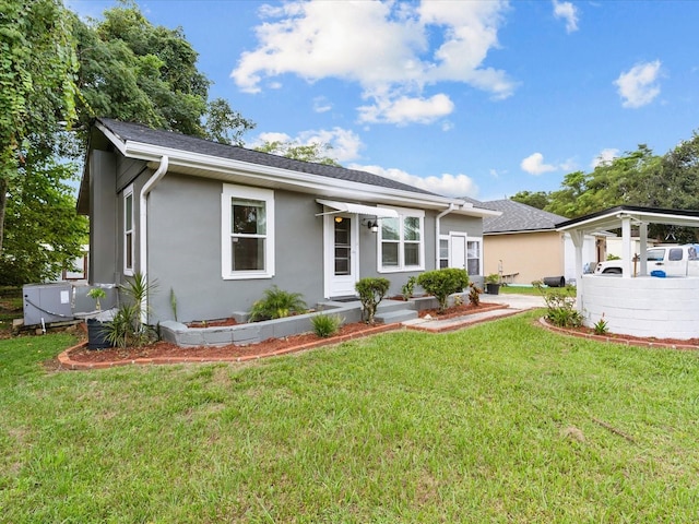 ranch-style home with a front lawn