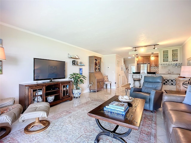 living room with crown molding and rail lighting