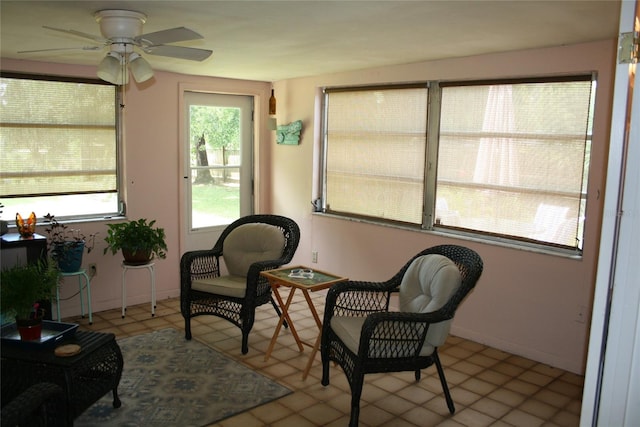 sunroom / solarium with ceiling fan