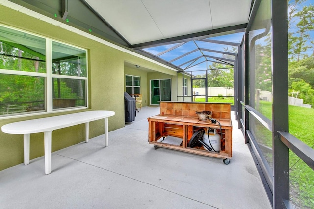 sunroom / solarium featuring lofted ceiling