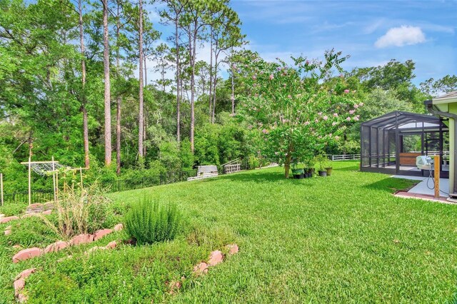 view of yard with a lanai