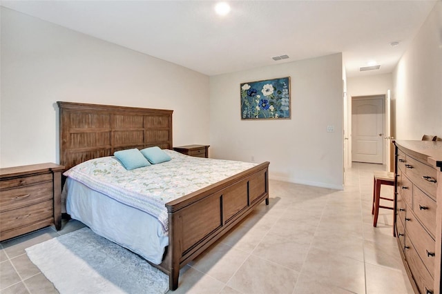 bedroom with visible vents, baseboards, and light tile patterned floors