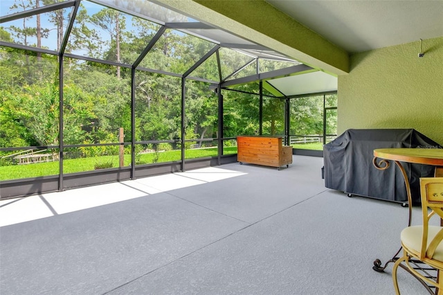 view of patio / terrace with area for grilling and a lanai