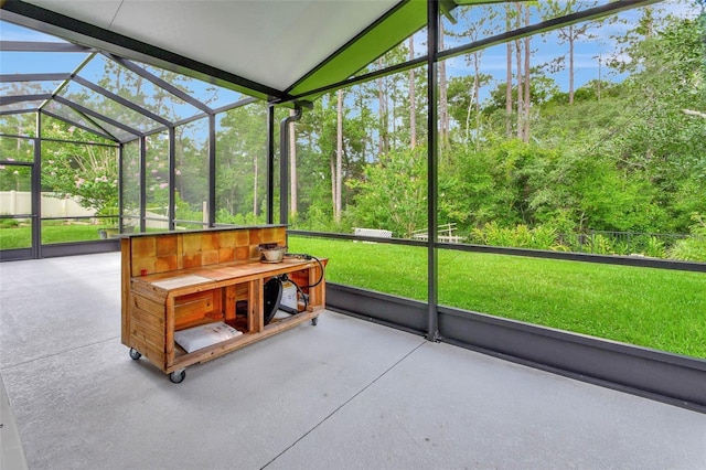 sunroom featuring lofted ceiling