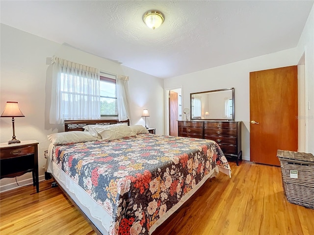 bedroom with light hardwood / wood-style floors