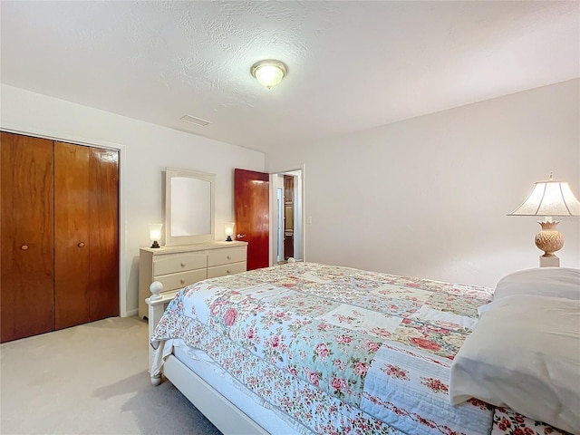 carpeted bedroom featuring a closet