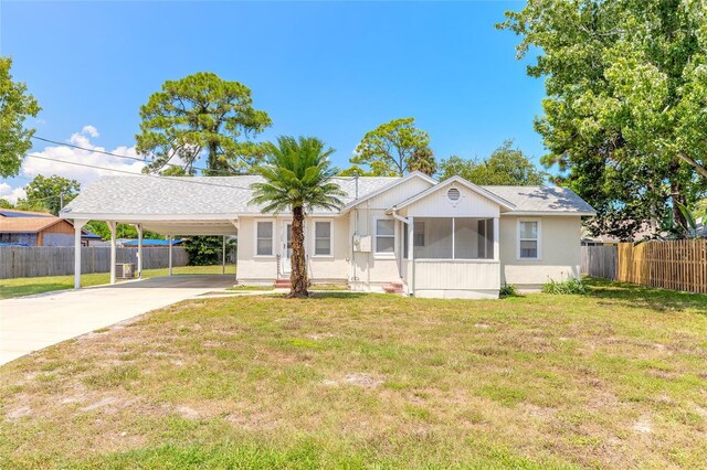 ranch-style house with a carport and a front yard