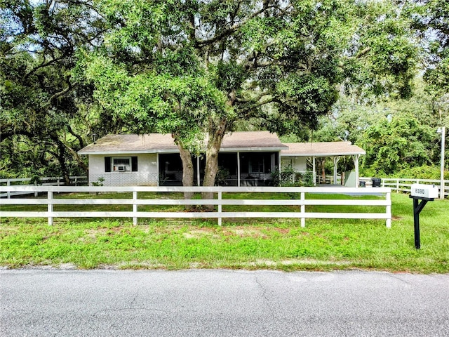 ranch-style house with a front lawn