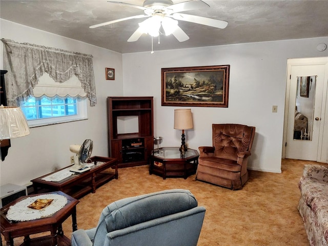 living room featuring ceiling fan and light colored carpet