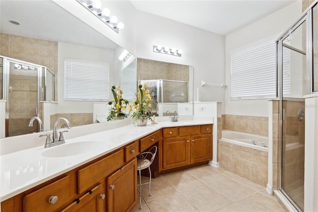 bathroom with tile patterned floors, separate shower and tub, and vanity