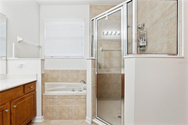 bathroom featuring vanity, independent shower and bath, and tile patterned flooring