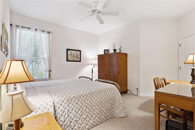 bedroom featuring light carpet and ceiling fan