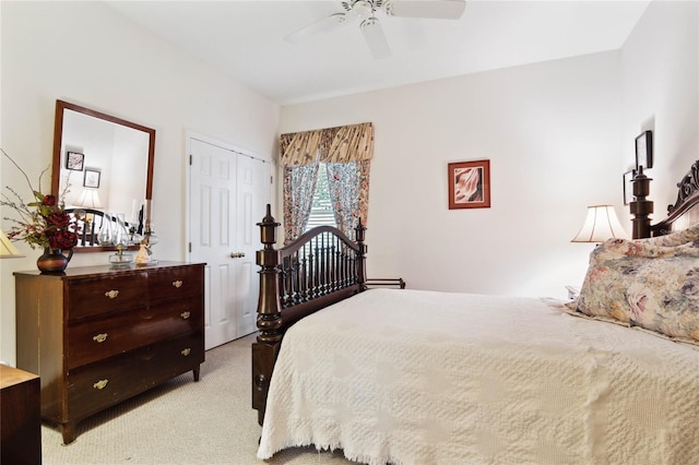 bedroom featuring light colored carpet, a closet, and ceiling fan