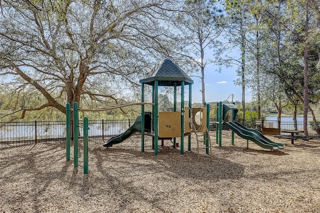 view of jungle gym featuring a water view