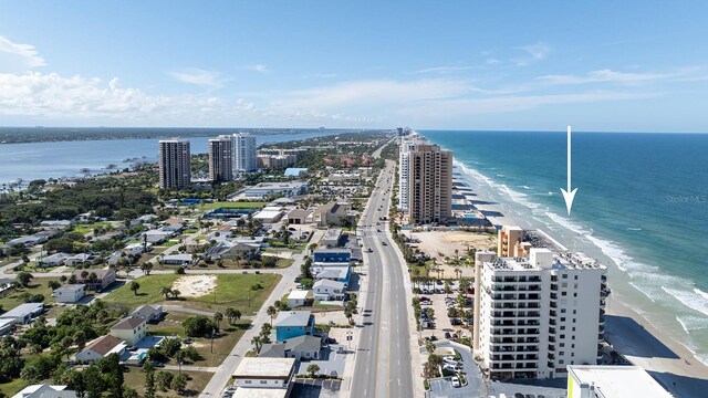 bird's eye view featuring a water view and a view of the beach