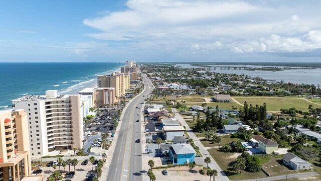 aerial view with a water view and a view of the beach