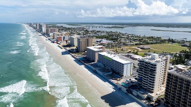 birds eye view of property featuring a view of the beach and a water view