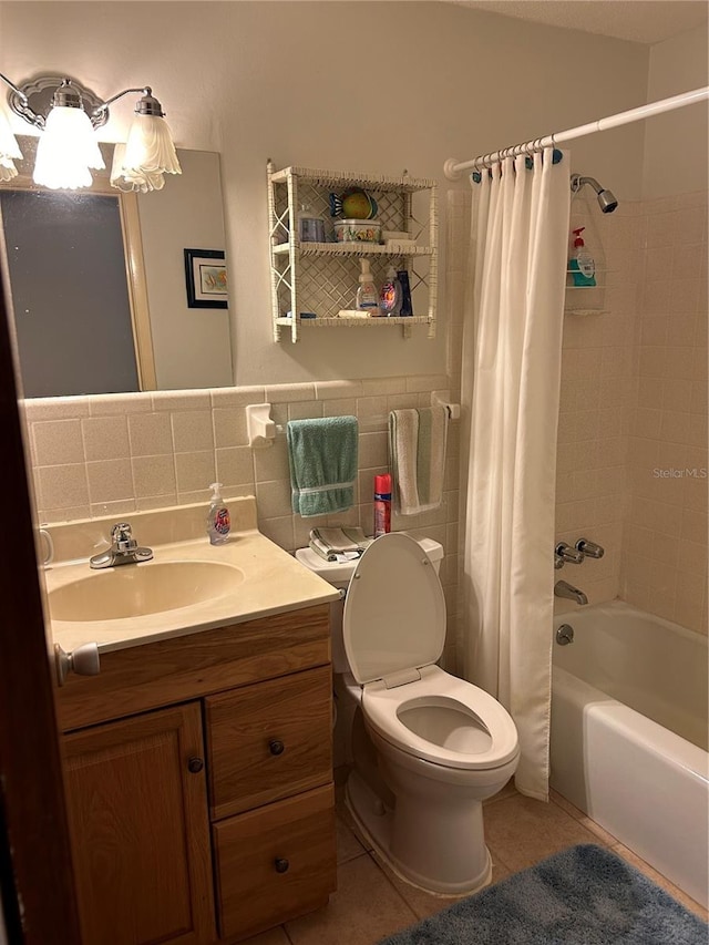 full bathroom with vanity, shower / tub combo, tasteful backsplash, tile patterned flooring, and toilet