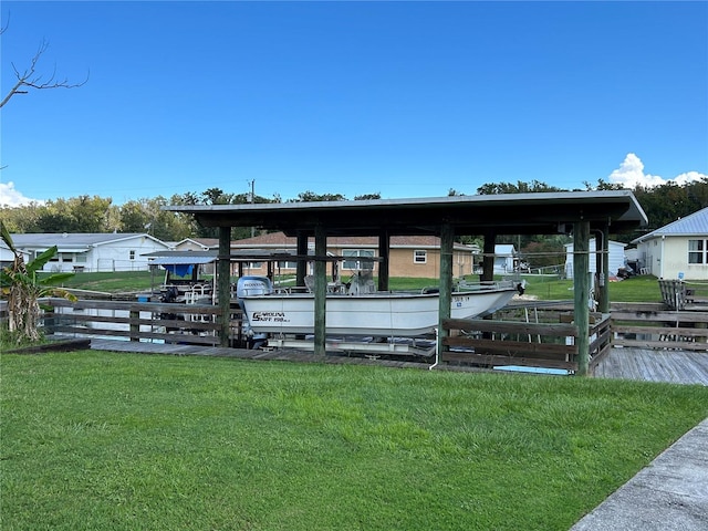 view of dock with a lawn