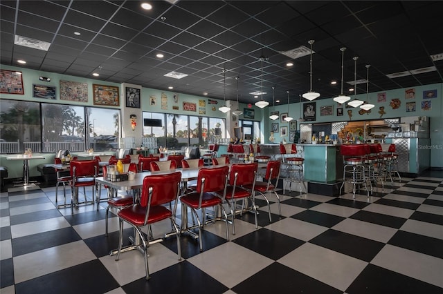 dining space featuring a paneled ceiling