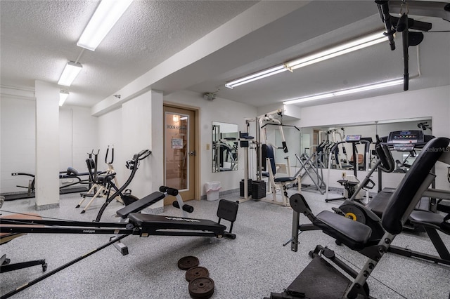 gym with a textured ceiling