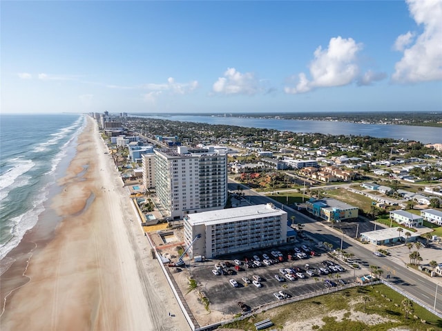 bird's eye view with a water view and a view of the beach