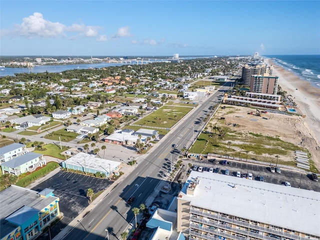 aerial view featuring a view of the beach and a water view