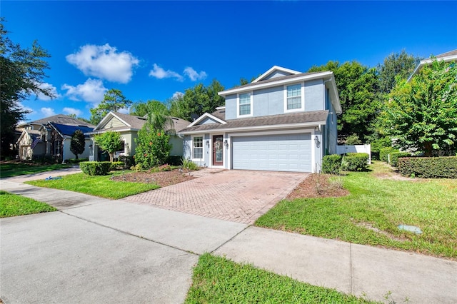 view of front property featuring a front yard and a garage