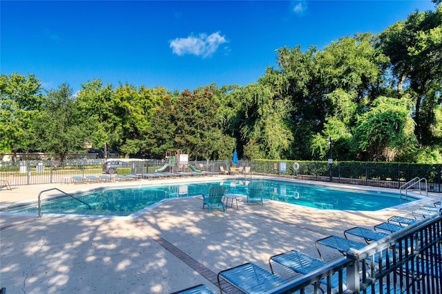 view of pool featuring a patio