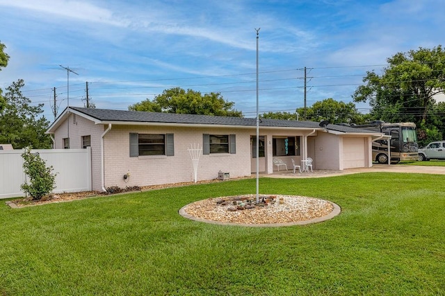 ranch-style home with a front lawn