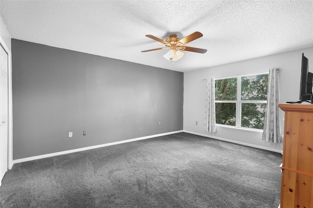 unfurnished bedroom featuring a textured ceiling, carpet flooring, and ceiling fan