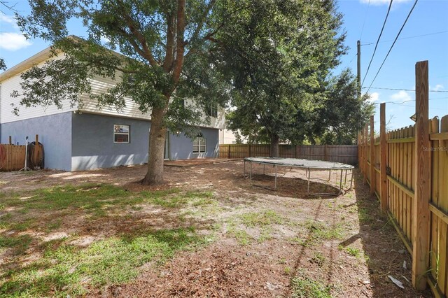 view of yard with a trampoline