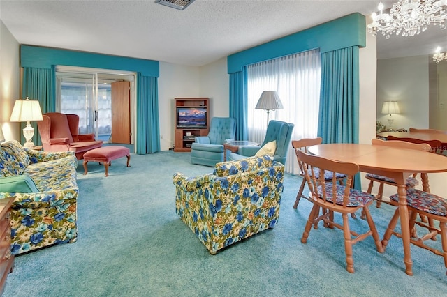 carpeted living area featuring a chandelier, a textured ceiling, and visible vents