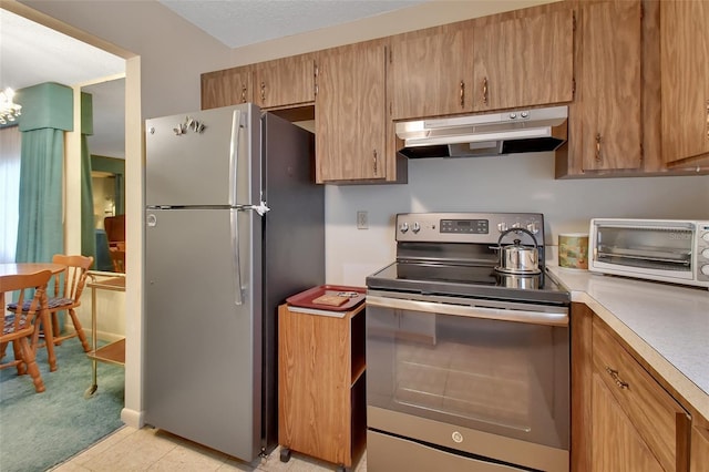 kitchen with light tile patterned floors and appliances with stainless steel finishes