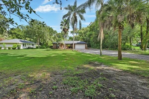 view of yard with a garage