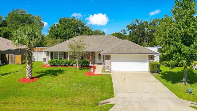 ranch-style home featuring a garage and a front yard