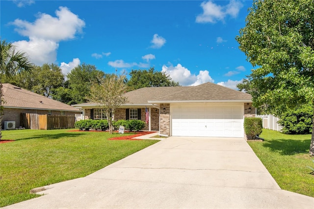 single story home featuring a garage and a front yard