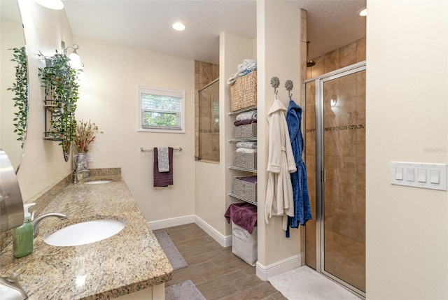 bathroom with vanity and an enclosed shower